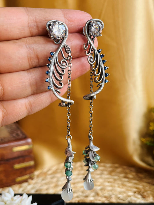 Buy Zehra Oxidised Brass Leaf Dangle Earrings In White Stone online in India. Shop oxidized jewellery for festivals and office and daily wearing in affordable range.-first