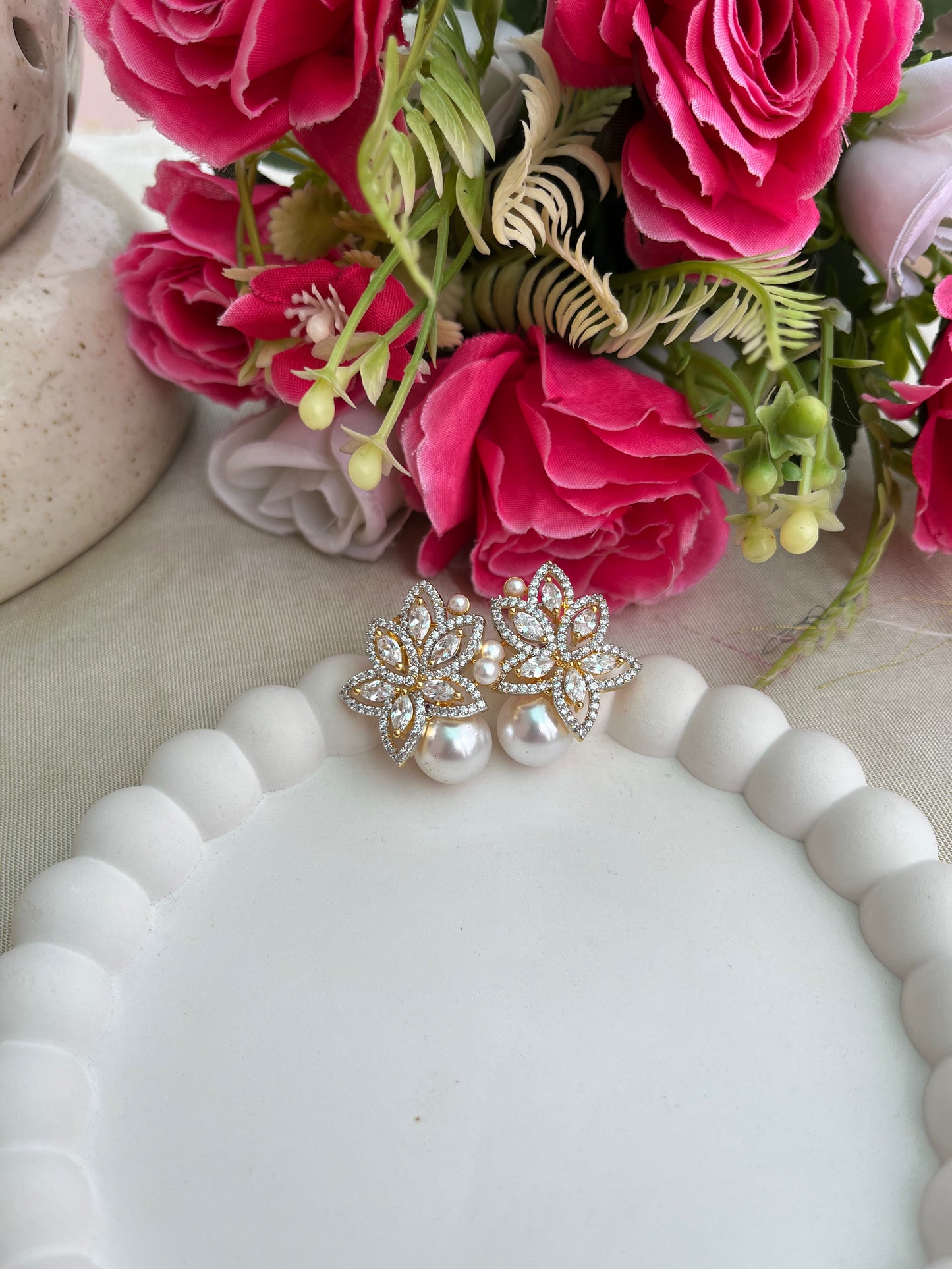 Buy Floral Golden Stud Earrings With Pearl Drop In AD online in India. Shop AD earrings, bridal AD jewelry, AD necklace sets for weddings, engagements and parties.  -side