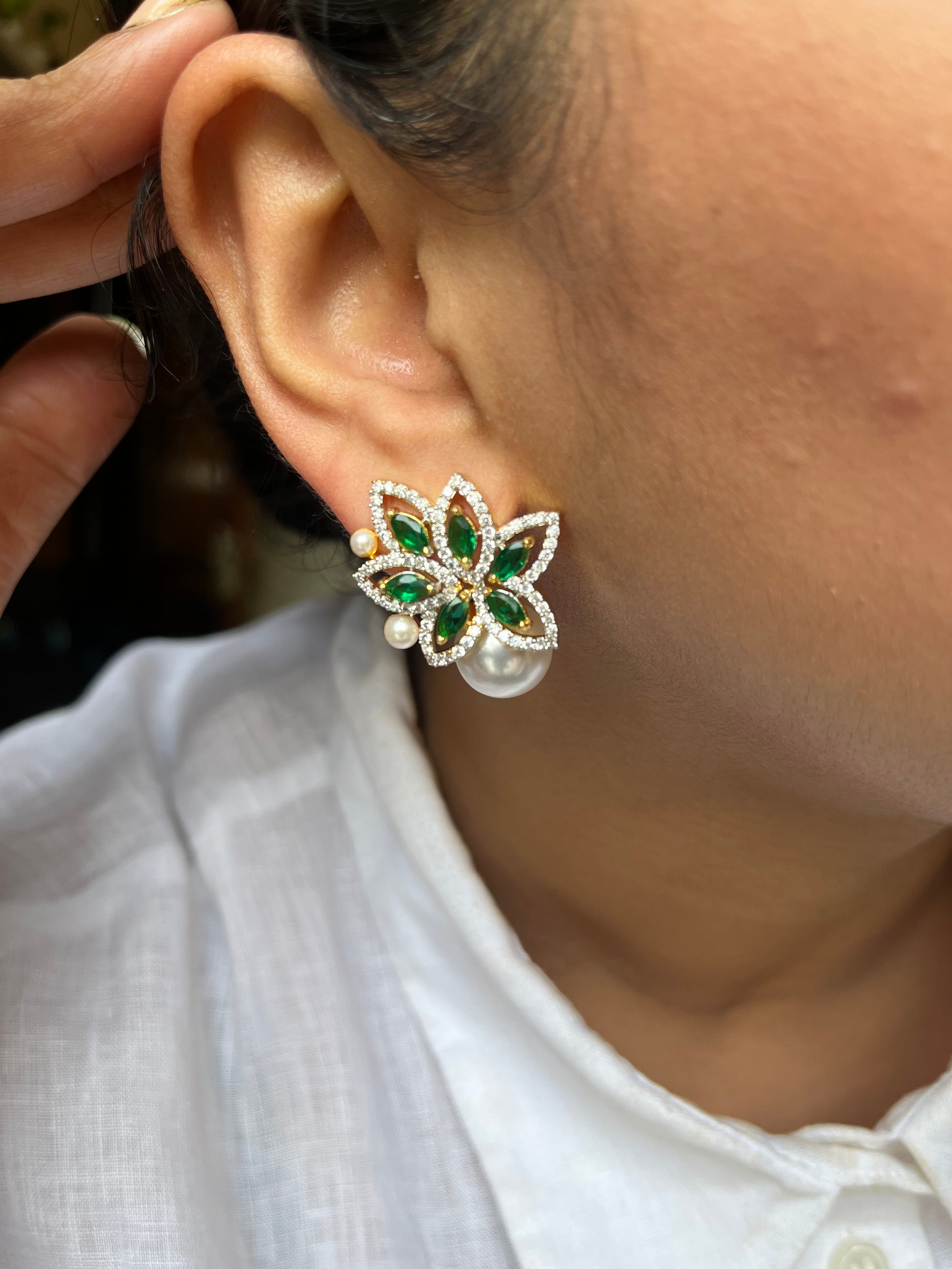Buy Floral Stud Earrings With Pearl Drop In AD online in India. Shop AD earrings, bridal AD jewelry, AD necklace sets for weddings, engagements and parties.  -side 