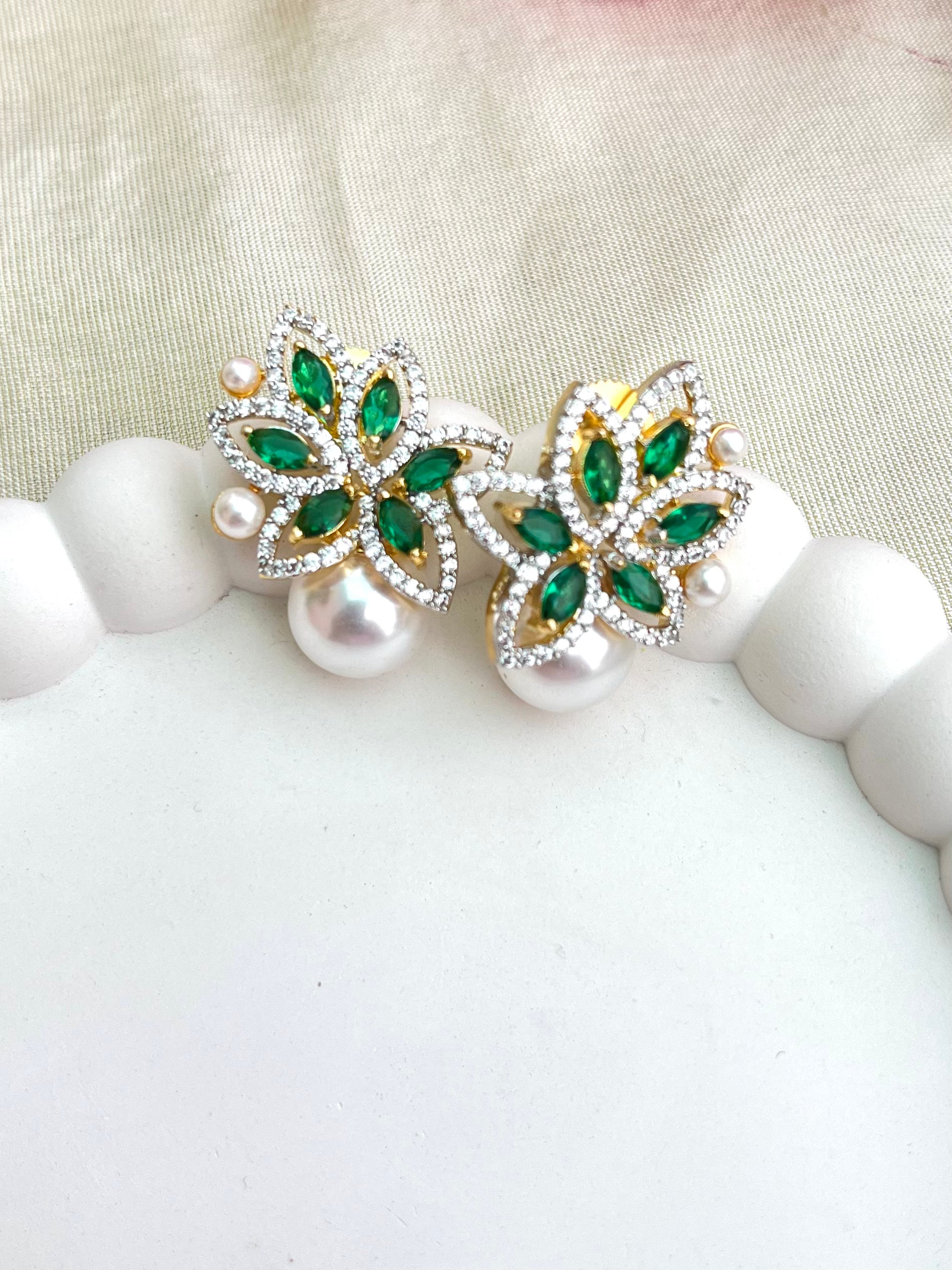 Buy Floral Stud Earrings With Pearl Drop In AD online in India. Shop AD earrings, bridal AD jewelry, AD necklace sets for weddings, engagements and parties.  -front