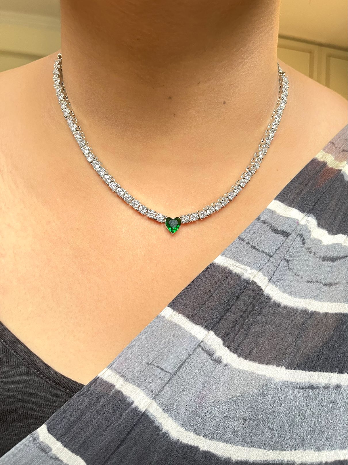 Shop Solitaire Look String With Green Heart Shaped Stone In CZ online in India. Explore elegant bridal AD jewellery online. Shop premium bridal jewellery sets in Zircon, AD, Kundan, Victorian Diamond. Collection best suited for Indian weddings, parties and special occasions. Buy solitaire string in green stone for sarees, lehengas and gowns. -front