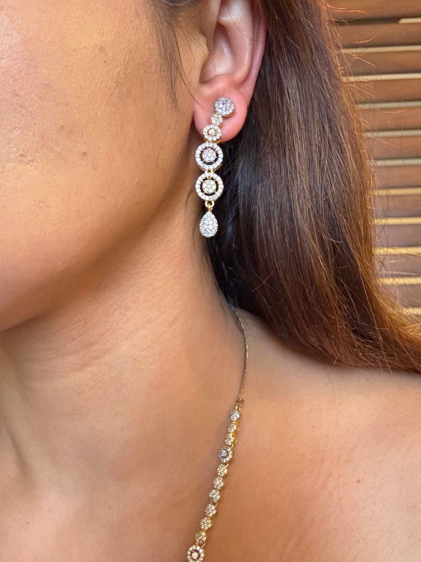 Shop Festive Light Party Set In Gold & Rhodium Plating online in India. Explore bridal AD jewellery online. Premium bridal jewellery sets in Zircon, AD, Kundan, Victorian Diamond. -side