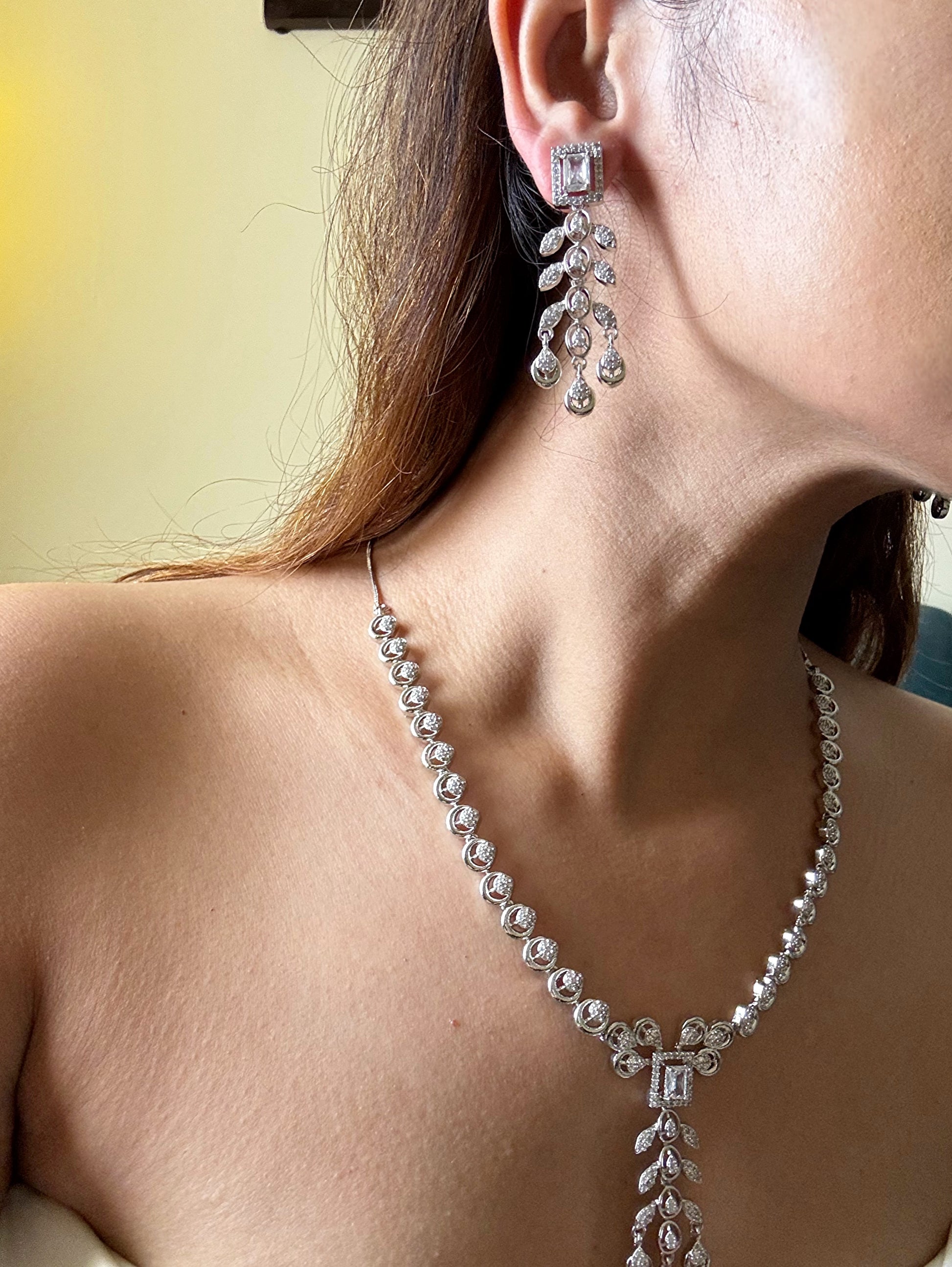 Buy AD Set With Maang Tikka online in India with earrings. Shop an exclusive range of zircon jewellery, Indian wedding jewelry, kundan jewellery, AD earrings, AD necklace. -third