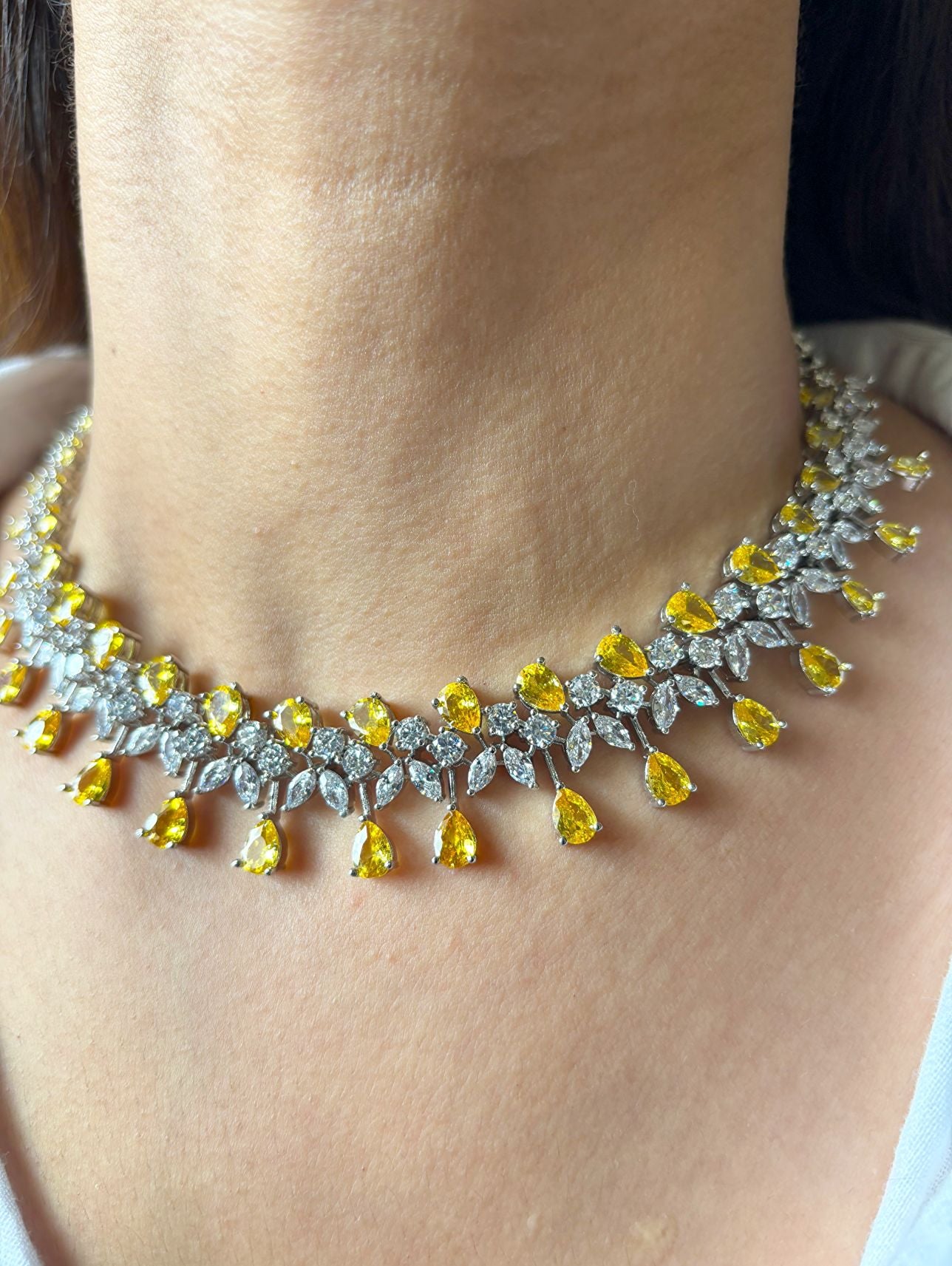 Shop Premium CZ Stones Heavy Sets In Yellow Stones online in India. Explore elegant bridal AD jewellery online. Shop premium bridal jewellery sets in Zircon, AD, Kundan, Victorian Diamond. Collection best suited for Indian weddings, parties and special occasions. Choose AD Necklace In red stone for sarees, lehengas and gowns. -front