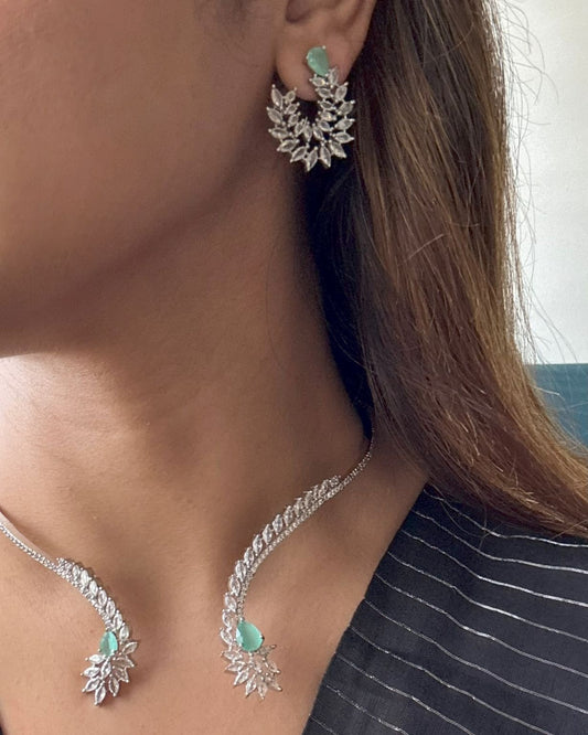 Shop Hasli Set With Floral Design in AD & Mint Green Stone Online in India. Perfect for brides seeking elegant AD jewellery online. Explore premium bridal jewellery online in AD, ideal for Indian weddings and special occasions. Shop AD jewellery in green stone online. -front