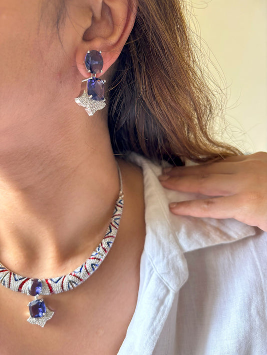 Shop Hasli Set With Purple Drop With Maang Teeka in AD & Nano Setting Stones Online in India. Perfect for brides seeking elegant AD jewellery online. Explore premium bridal jewellery online in AD, ideal for Indian weddings and special occasions. Shop AD jewellery in nano setting stones. -side