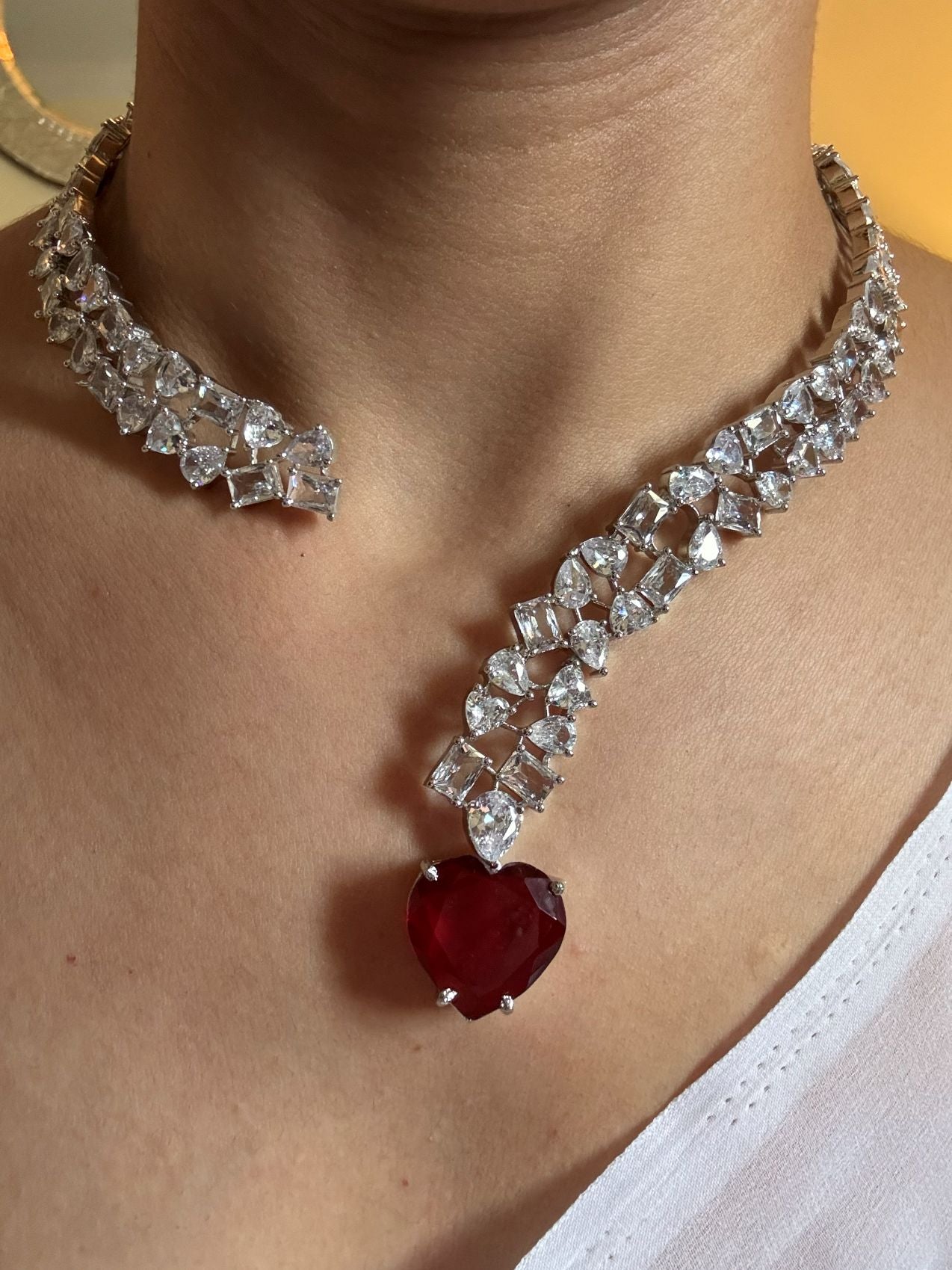 Shop Premium Hasli With Heart Pendant In CZ Stones online in India. Explore premium bridal jewellery online in AD. Shop AD jewellery in green stone online. -front