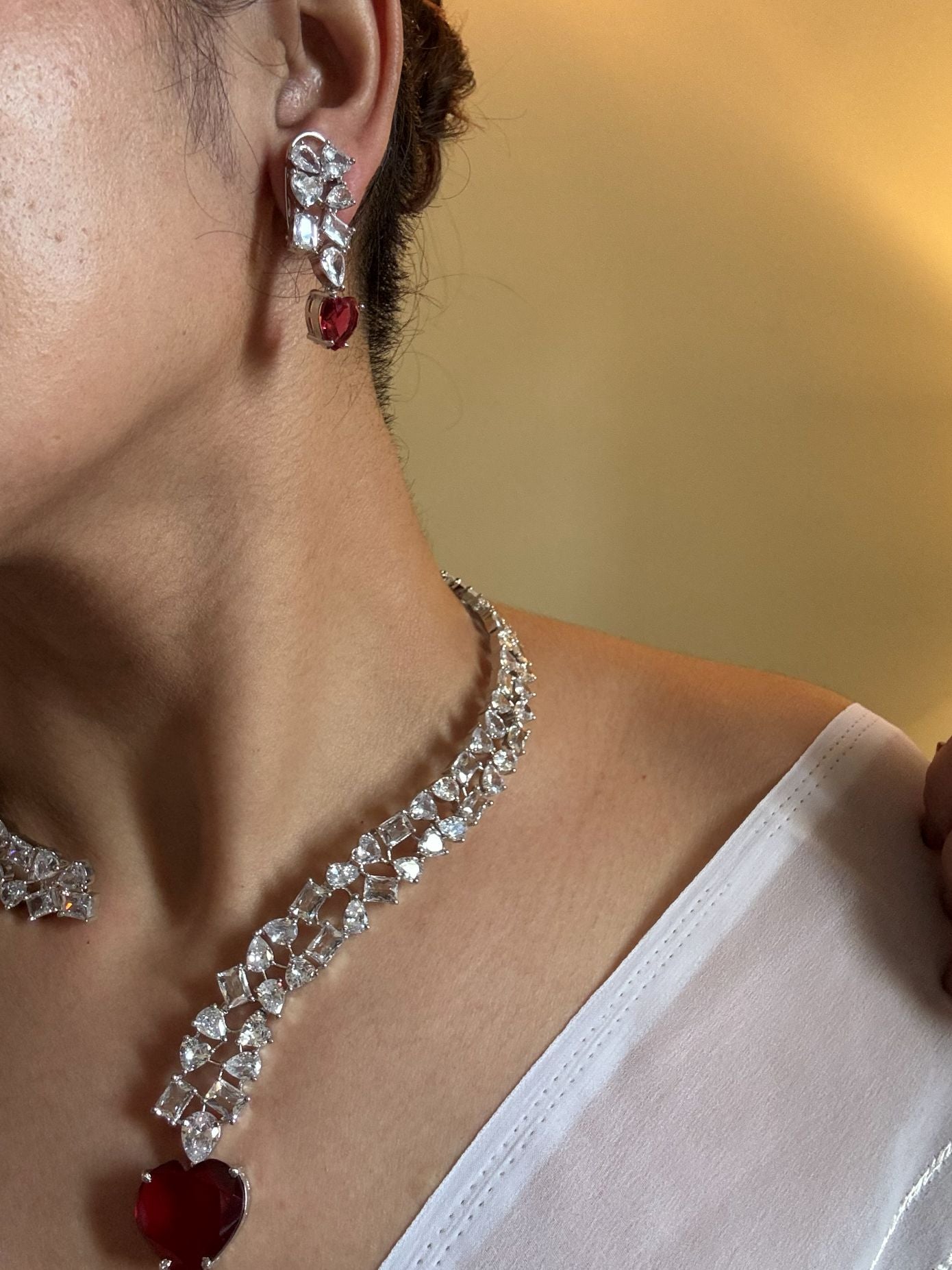 Shop Premium Hasli With Heart Pendant In CZ Stones online in India. Explore premium bridal jewellery online in AD. Shop AD jewellery in green stone online. -first