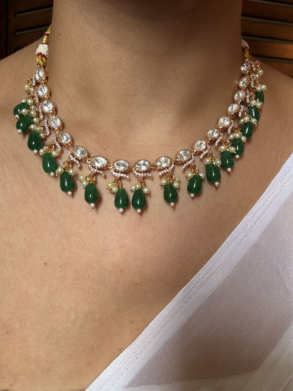 Buy Kundan Emerald Drops Necklace With Earrings online in India. Explore premium doublet stones jewellery online in AD. Shop AD jewellery in blue stone online. -front