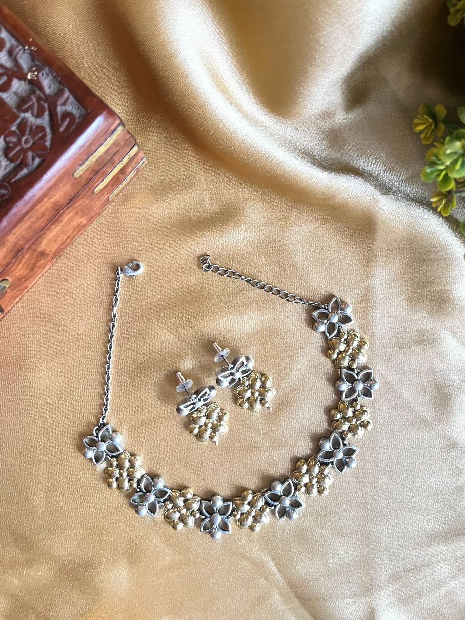 Buy Dual Tone Floral Necklace In Oxidized With Earrings online in India. Shop an exclusive range of oxidized jewellery for daily wearing and office wearing in affordable range. Below 500, 1000, 2000. -front