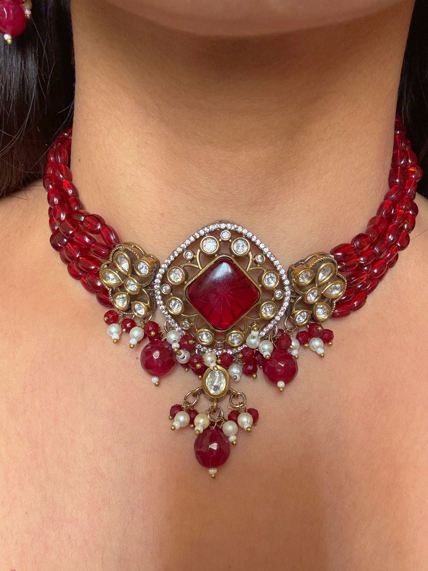 Buy Rajshree Red Stones Kundan Necklace With Earrings online in India. Shop from an exclusive range of CZ jewellery, gold plated, silver plated jewellery, gold polish earrings. -front