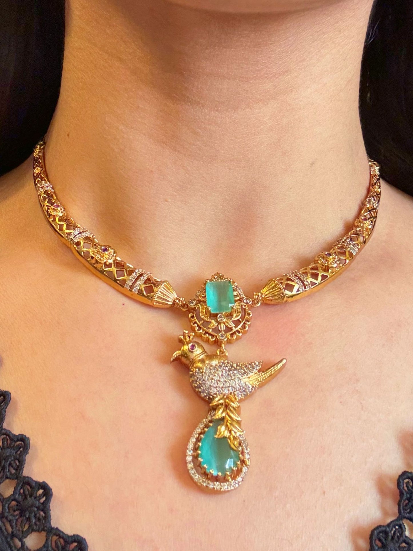 Buy Meghna Gold Plated Hasli Necklace In AD & Mint Green Stones online in India. Shop from an exclusive range of CZ jewellery, gold plated, silver plated jewellery. -front