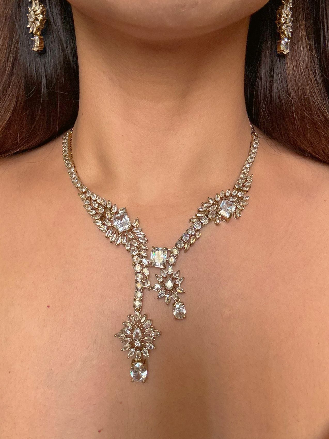 Buy Aarini White AD Heavy Necklace With Maang Tikka online in India. Shop from an exclusive range of CZ jewellery, gold plated, silver plated jewellery. -front