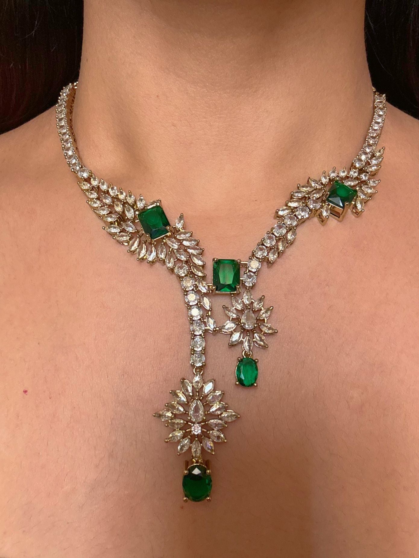 Buy Aarini Green AD Heavy Necklace With Maang Tikka online in India. Shop from an exclusive range of CZ jewellery, gold plated, silver plated jewellery. -front