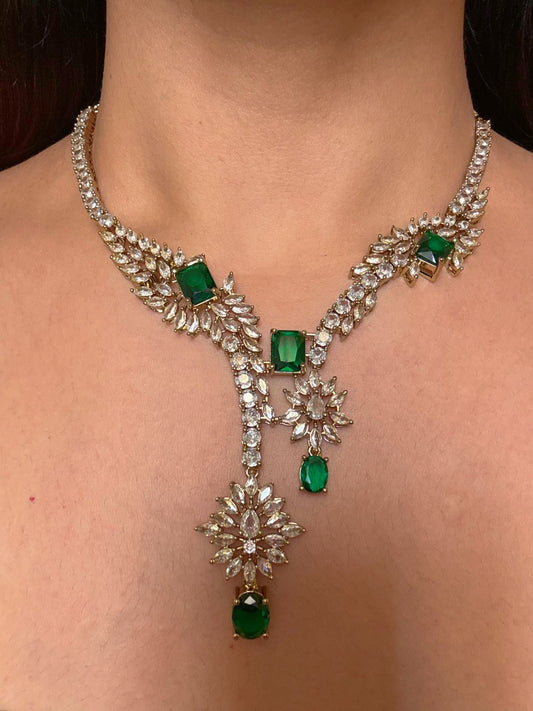 Buy Aarini Green AD Heavy Necklace With Maang Tikka online in India. Shop from an exclusive range of CZ jewellery, gold plated, silver plated jewellery. -front