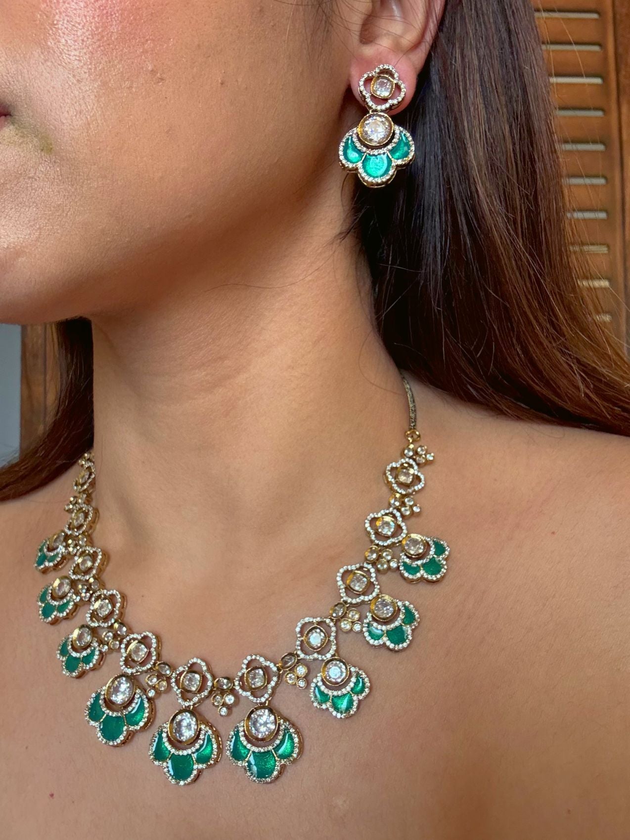 Buy Yogita Kundan AD Gold Polish Necklace In Green online in India. Shop from an exclusive range of CZ jewellery, gold plated, silver plated jewellery. -side