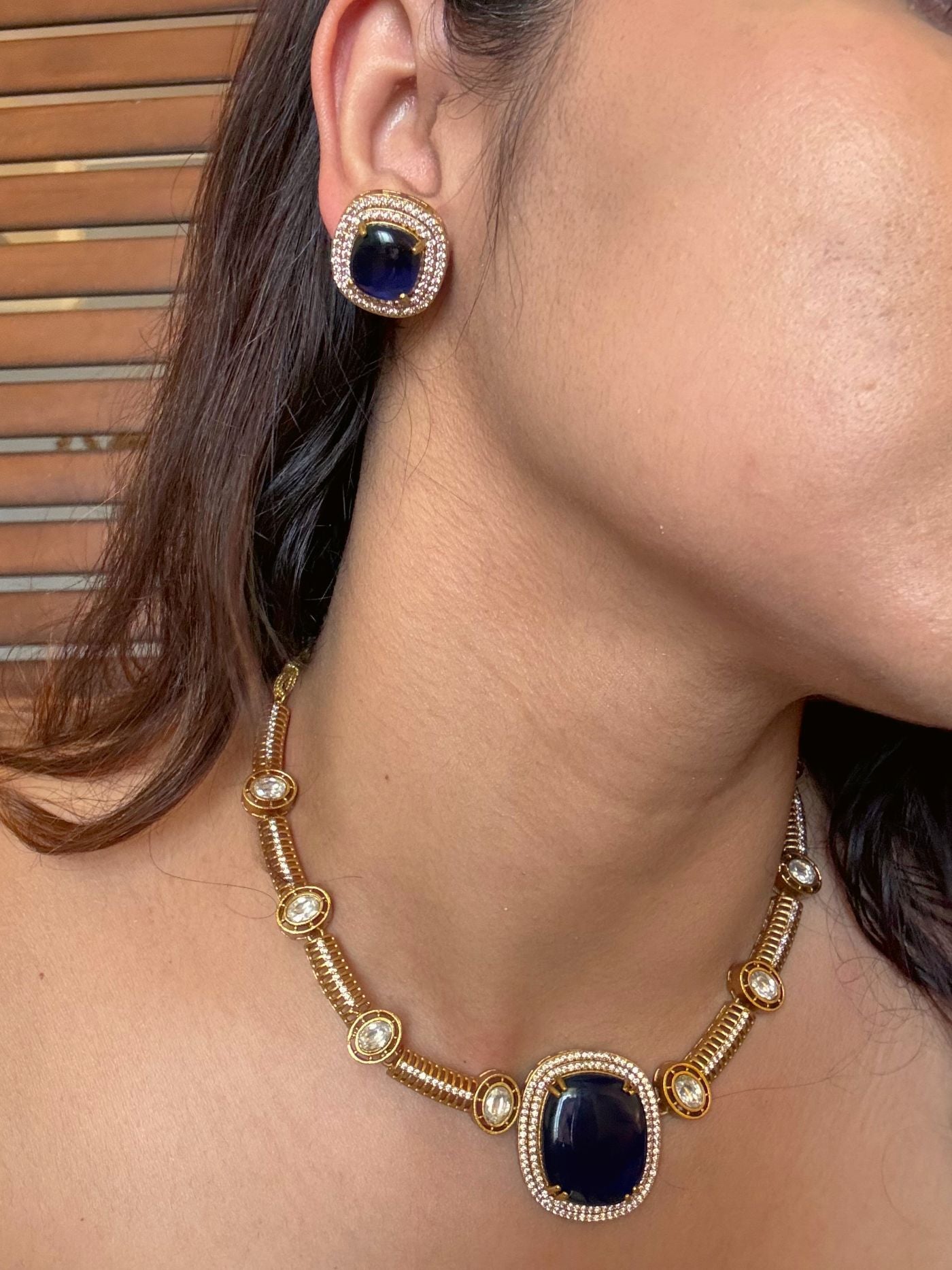 Buy Dharini Gold Polish Hasli Necklace In Navy Blue With Studs online in India. Shop from an exclusive range of moissanite jewellery, AD necklace, Kundan necklace for weddings. -side