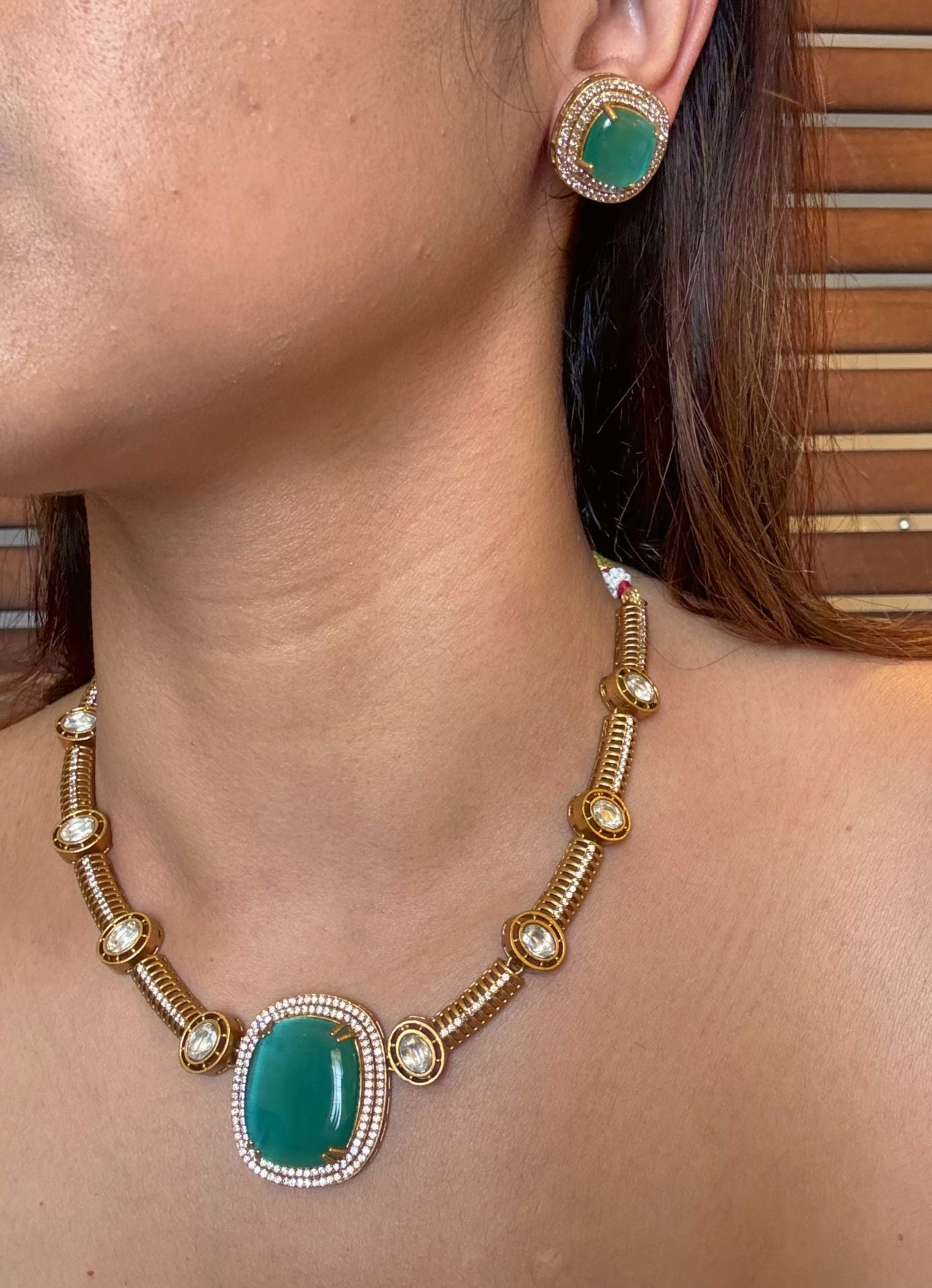 Buy Dharini Gold Polish Hasli Necklace In Mint Green With Studs online in India. Shop from an exclusive range of moissanite jewellery, AD necklace, Kundan necklace for weddings. -side