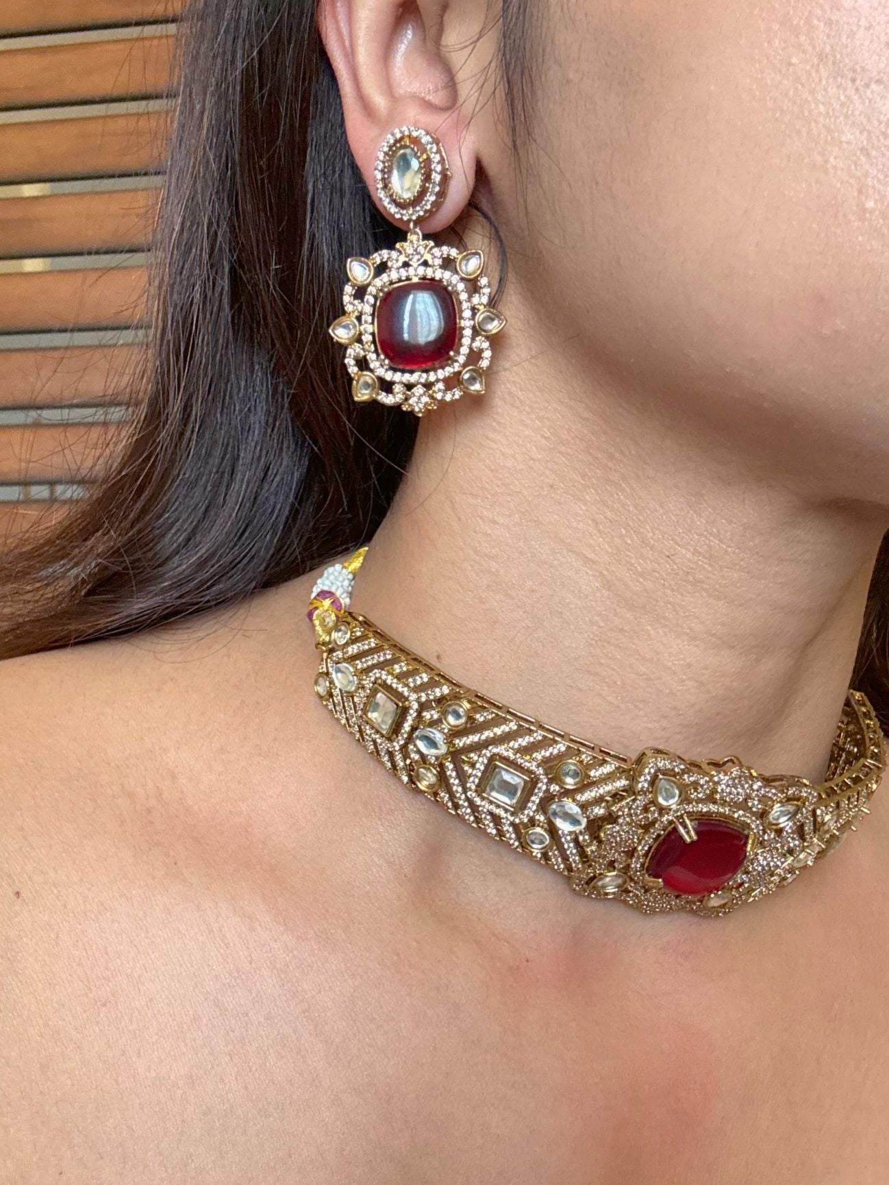 Buy Eshani Gold Polish AD Kundan Choker Necklace In Red online in India. Shop from an exclusive range of moissanite jewellery, AD necklace, Kundan necklace for weddings. -side