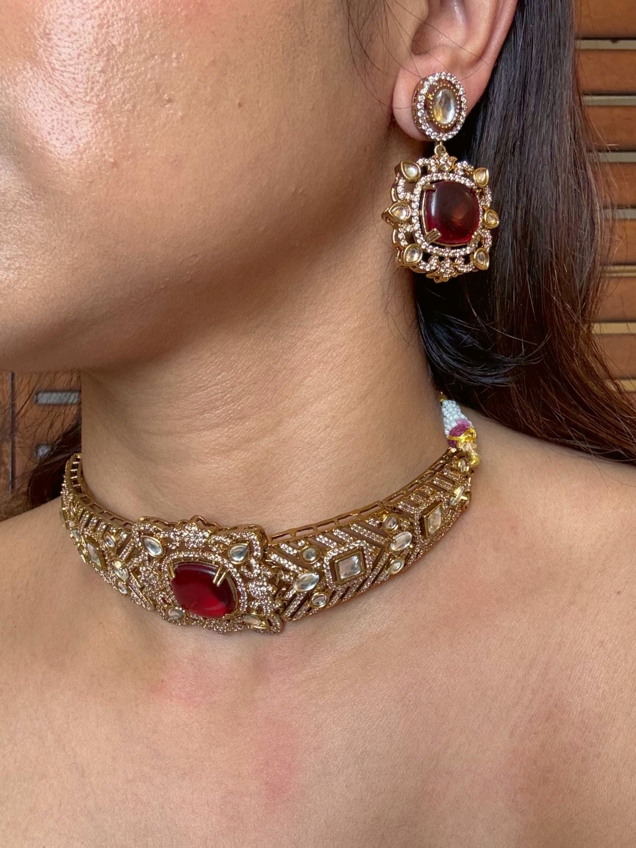 Buy Eshani Gold Polish AD Kundan Choker Necklace In Red online in India. Shop from an exclusive range of moissanite jewellery, AD necklace, Kundan necklace for weddings. -side