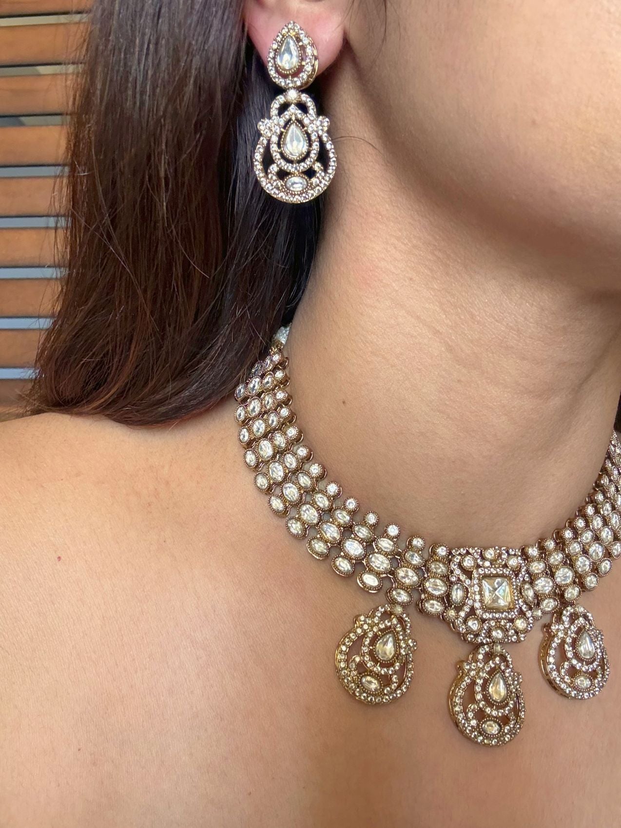 Buy Aadhya Moissanite AD Set With Tikka online in India. Shop from an exclusive range of CZ jewellery, moissanite jewellery, AD necklace, Kundan necklace for weddings. -side