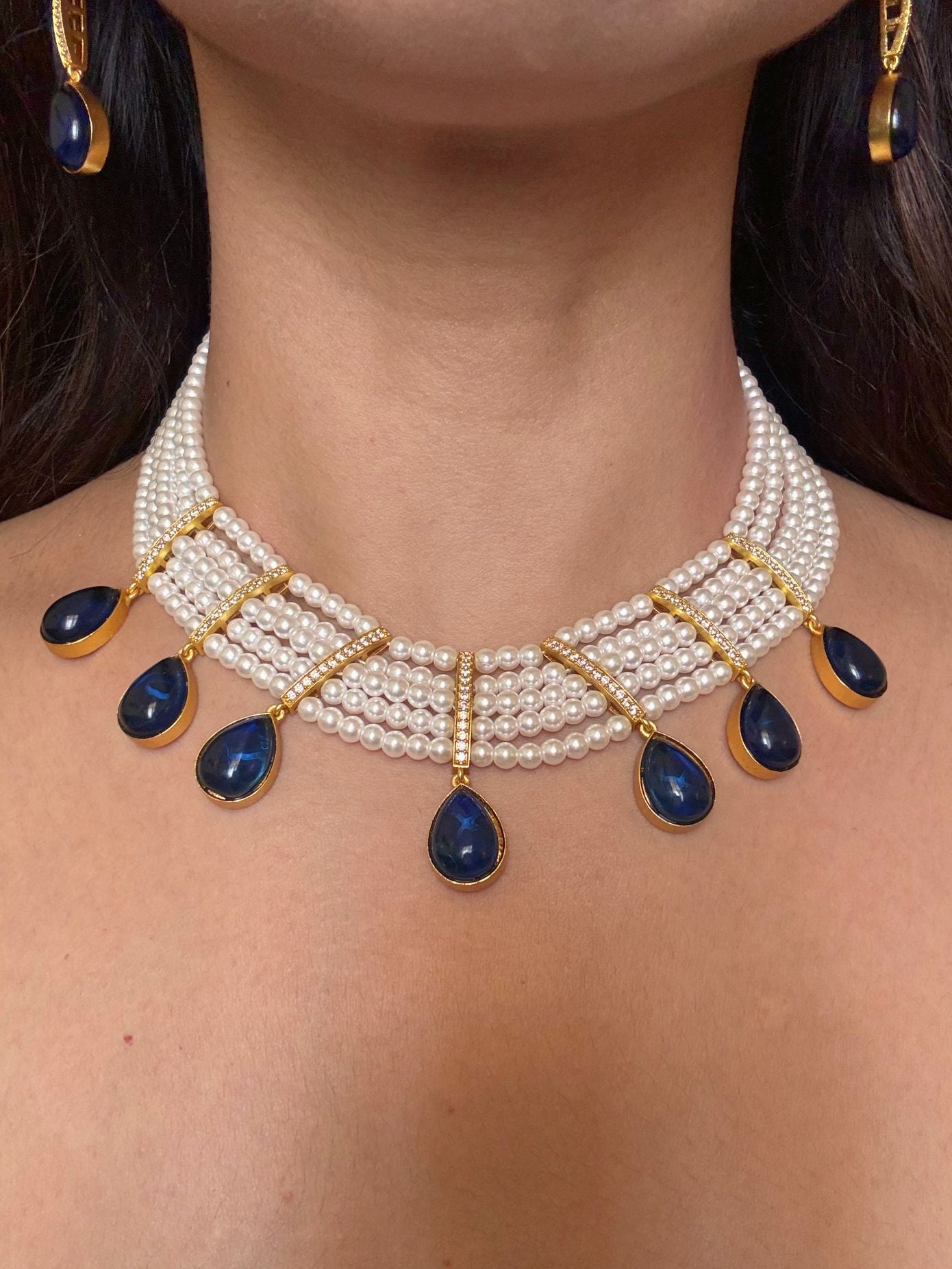 Buy Priyaanka Pearl Necklace With Blue Stone Drops online in India. Shop from an exclusive range of CZ jewellery, moissanite jewellery, AD necklace, Kundan necklace for weddings. -FIRST