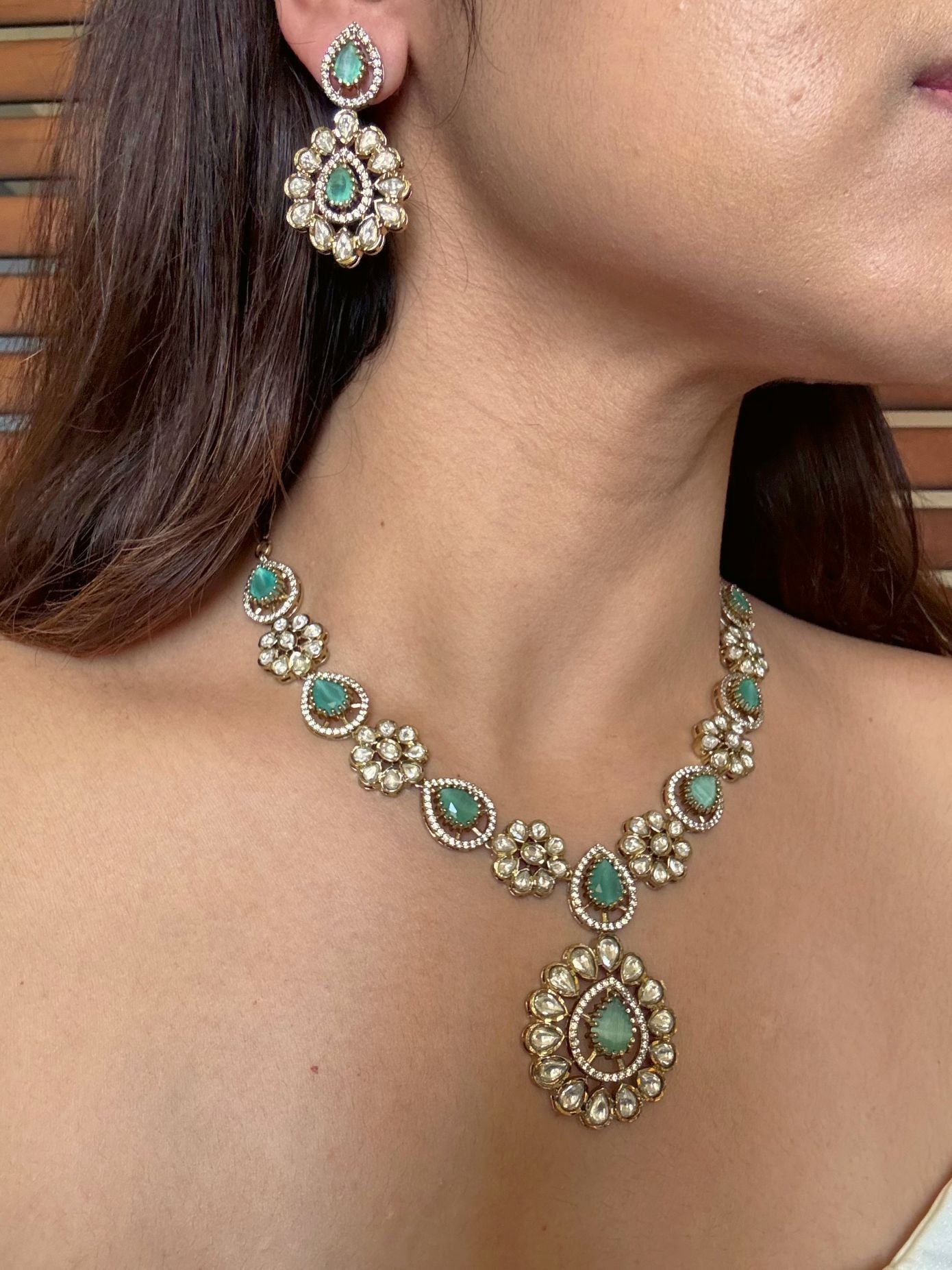 Buy Prisha Mint Green Floral Moissanite Necklace online in India. Shop from an exclusive range of CZ jewellery, moissanite jewellery, AD necklace, Kundan necklace for weddings. -side