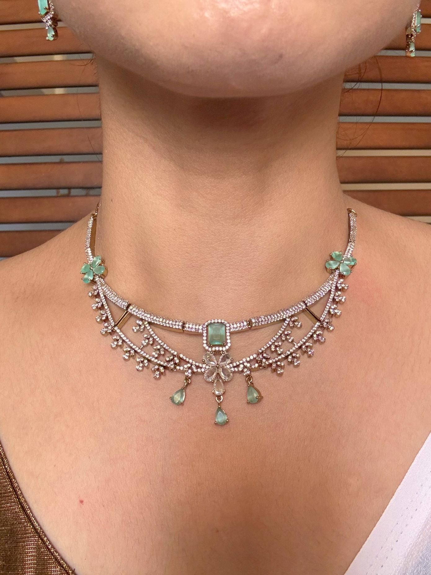 Buy Meherza Mint Blossom Diamond Imitation Necklace Set online in India. Shop from an exclusive range of jewellery, AD necklace, Kundan necklace for weddings. -front