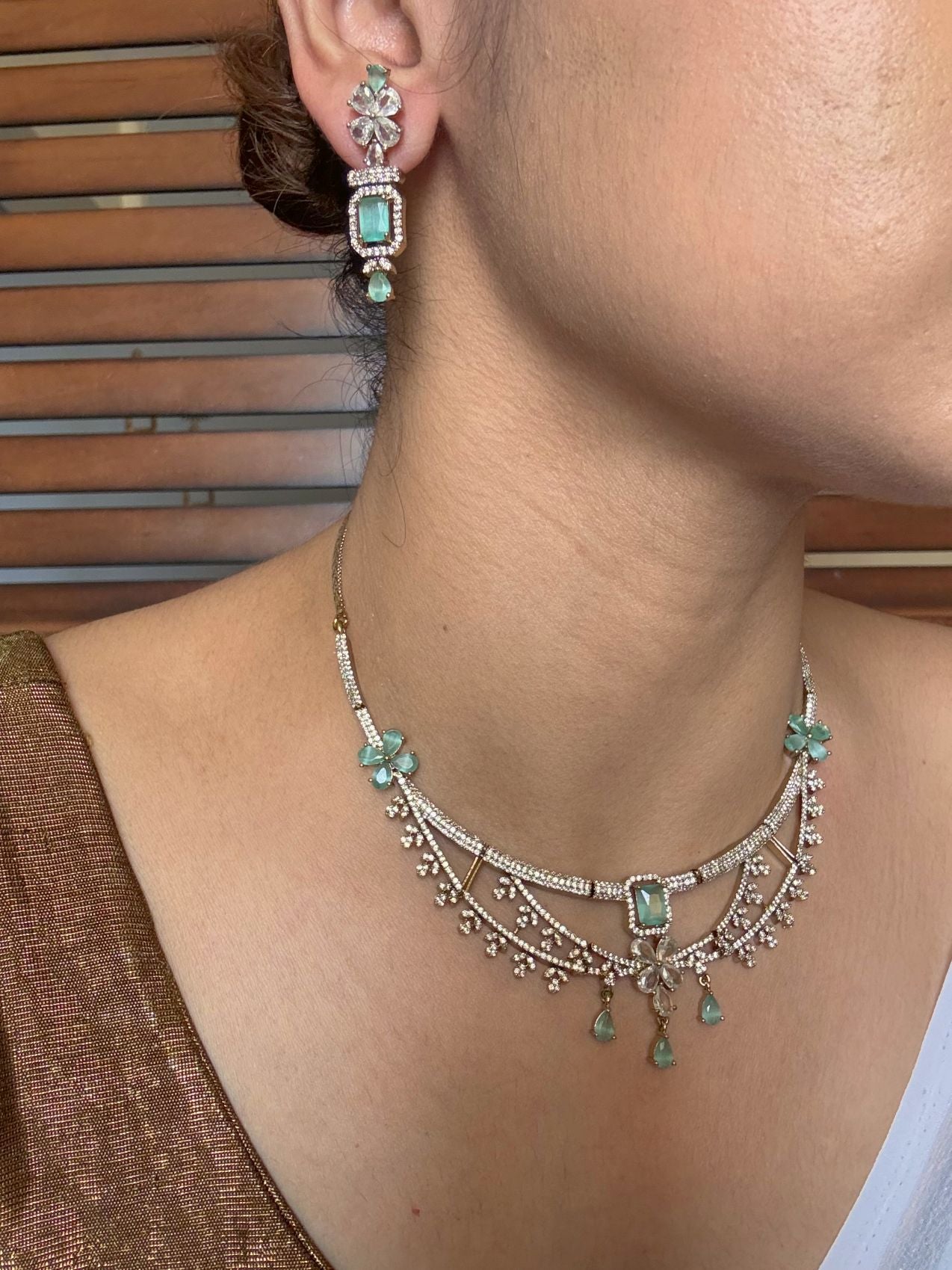 Buy Meherza Mint Blossom Diamond Imitation Necklace Set online in India. Shop from an exclusive range of jewellery, AD necklace, Kundan necklace for weddings. -side