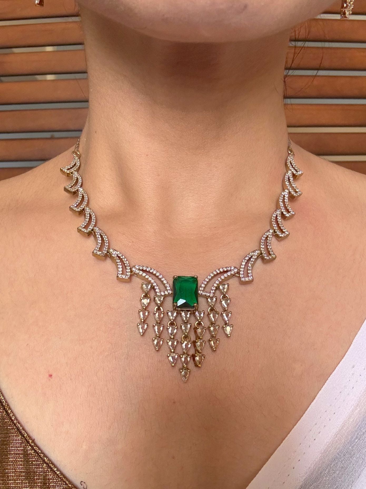 Buy Rukmini AD Necklace With Green Stone Accent online in India. Shop from an exclusive range of jewellery, AD necklace, Kundan necklace for weddings. -front