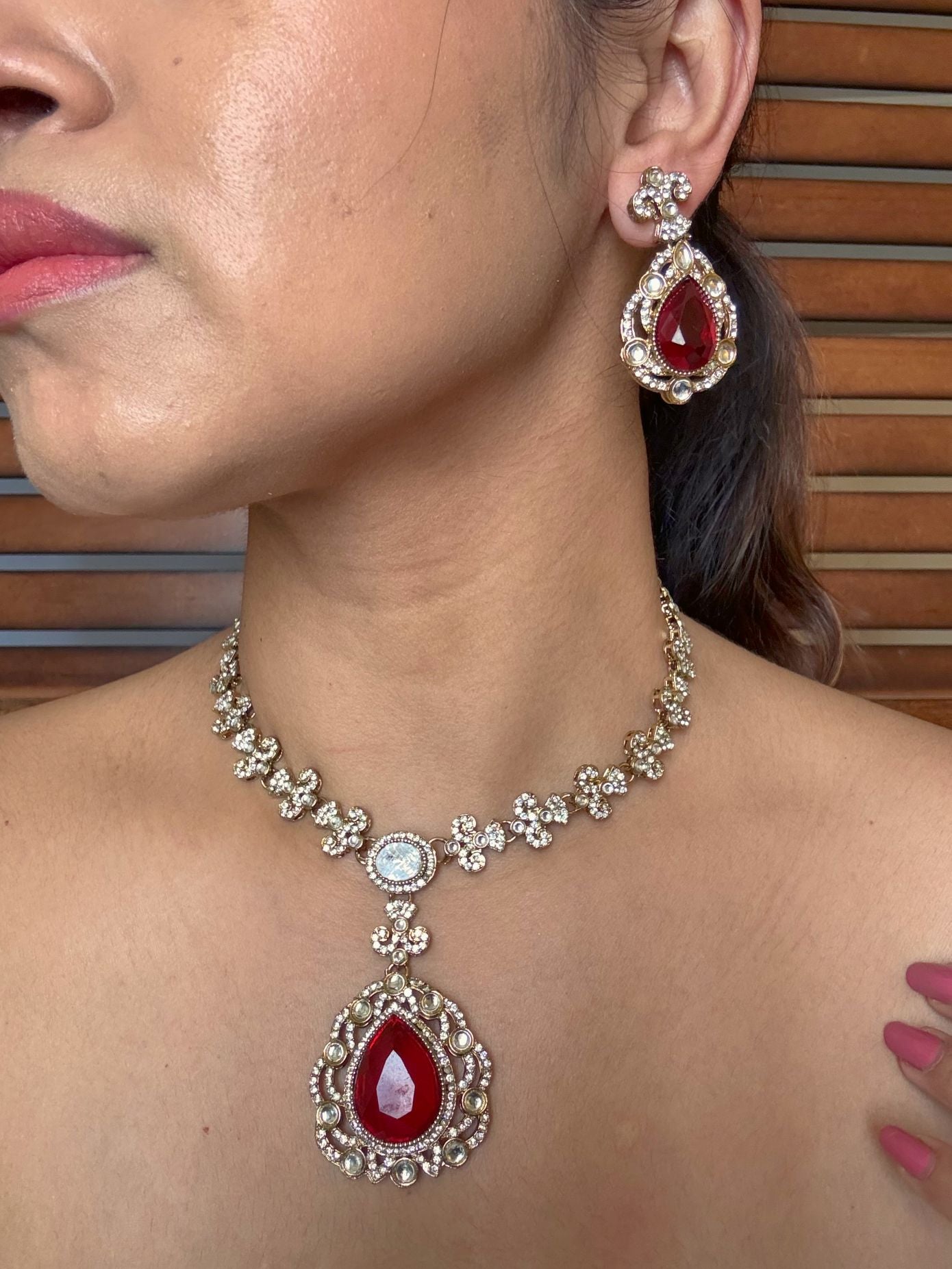 Buy Ruhani Red Stone AD Kundan Necklace Set With Tikka online in India. Shop from an exclusive range of jewellery, AD necklace, Kundan necklace for weddings. -side