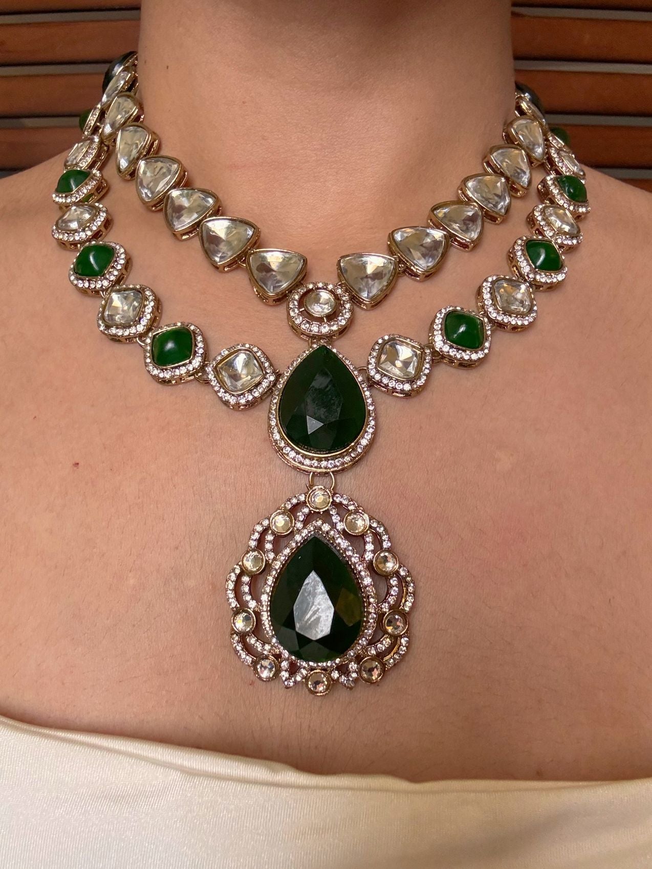 Buy Green Kundan Layered Wedding Necklace Set With Tikka online in India. Shop from an exclusive range of jewellery, AD necklace, Kundan necklace for weddings. -front