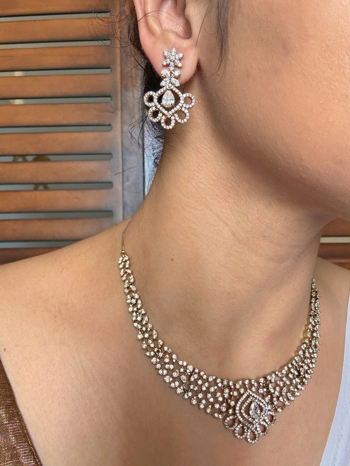 Shop Suganda Elegant AD Necklace In White With Earrings online in India. Shop from an exclusive range of jewellery, gold imitation necklace, brass necklace for weddings. -full
