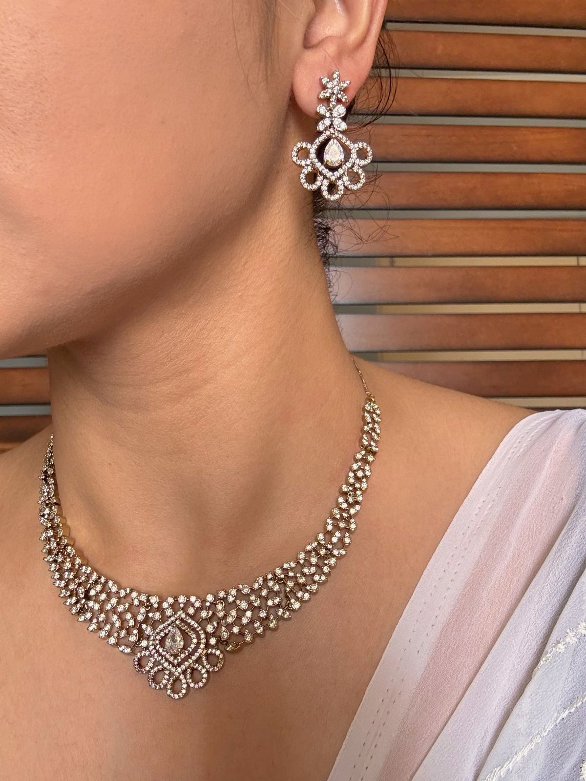 Shop Suganda Elegant AD Necklace In White With Earrings online in India. Shop from an exclusive range of jewellery, gold imitation necklace, brass necklace for weddings. -second