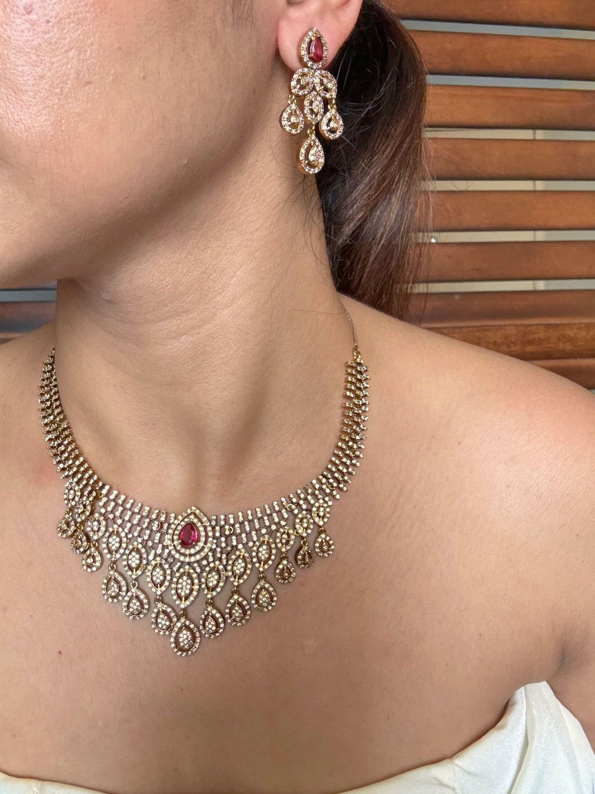 Shop jharna antique AD necklace set online in India in red stone. Shop from an exclusive range of jewellery, AD necklace, Kundan necklace for weddings. -side