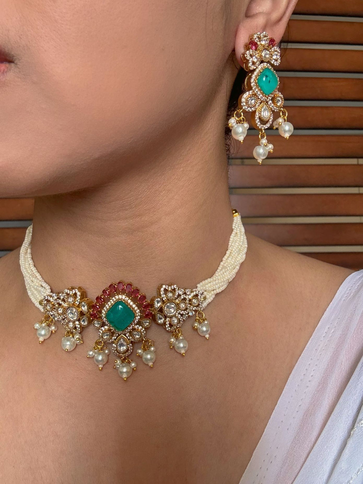 Buy Mohana Moissanite Choker In Pearl And Green Stones online in India. Shop from an exclusive range of jewellery, AD necklace, Kundan necklace for weddings. -side