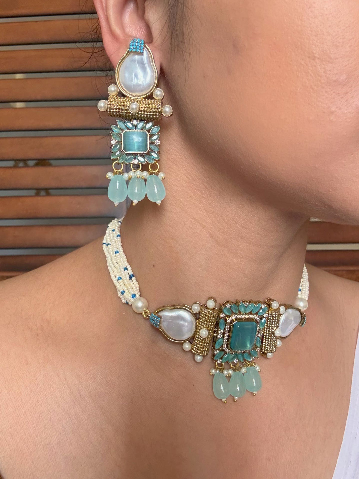 Buy Avya Statement Blue Stones Choker With Heavy Earrings online in India. Shop from an exclusive range of jewellery, AD necklace, Kundan necklace for weddings. -side