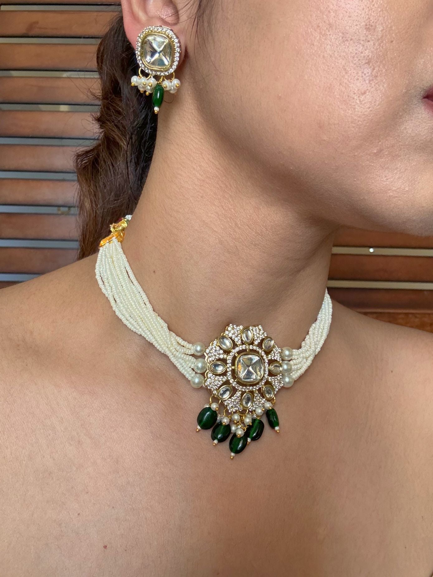 Buy Kaalki Statement Pearl Kundan Choker In Emerald Green online in India. Shop from an exclusive range of jewellery, AD necklace, Kundan necklace for weddings. -side