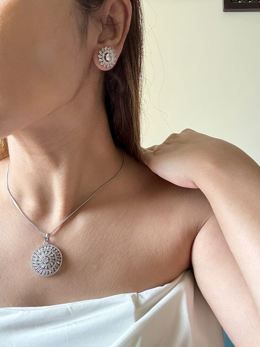 Shop Kiara Round Pendant Set With Studs In AD Online in India. Pendant sets in different stones like Kundan, Moissanite, CZ stones and AD stones in all kinds quality are available online for purchase on website. Explore pendant sets for festive occasions perfect mothers and elderly ladies too. Pendant sets in green, blue, pink, red and white stones are available for wearing with sarees, lehengas, suits and Indo-westerns. -first