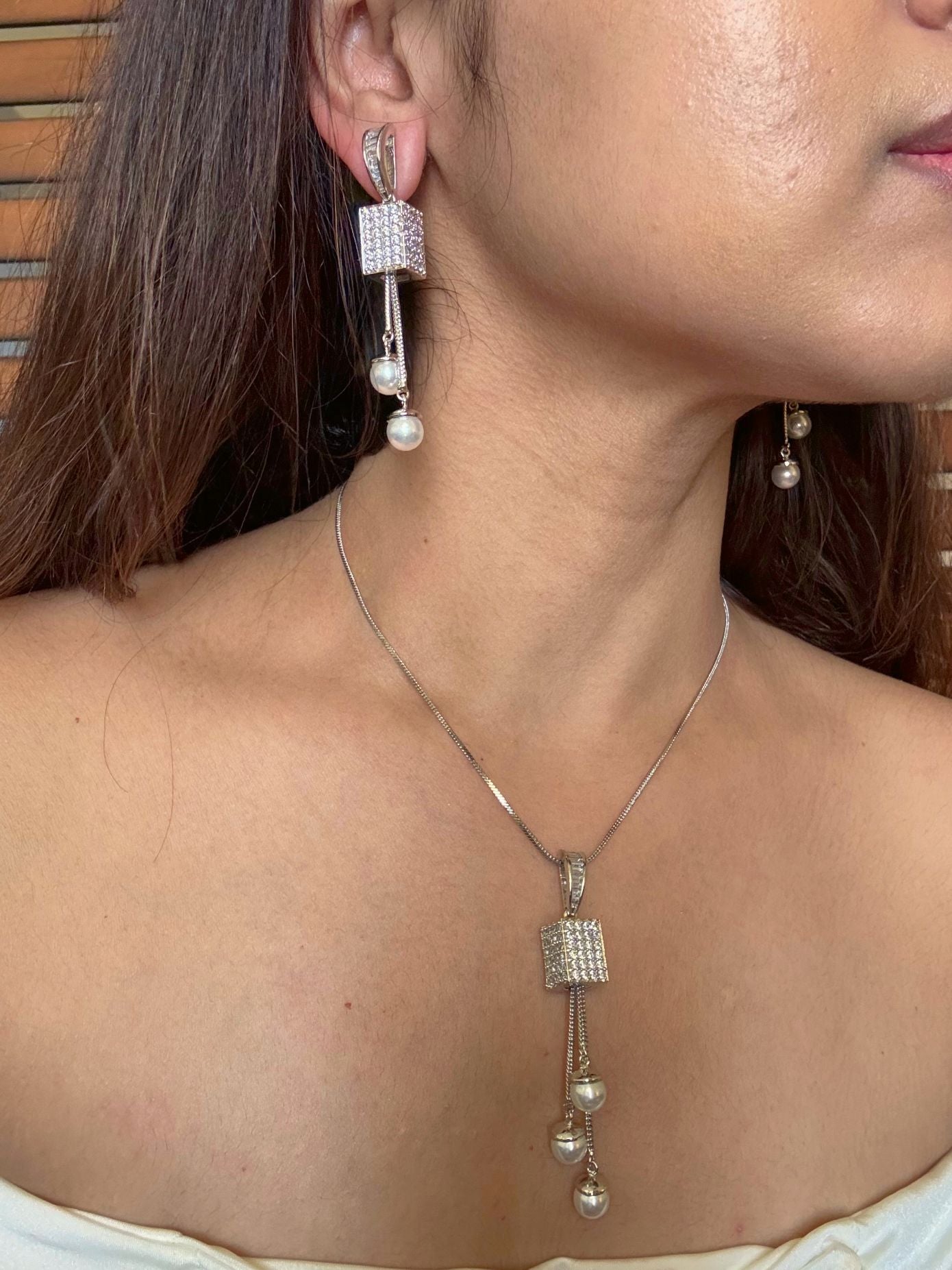 Shop Kashwini Nano Setting AD Pendant Set With Pearl Hangings Online in India. Pendant sets in different stones like Kundan, Moissanite, CZ stones and AD stones. -side
