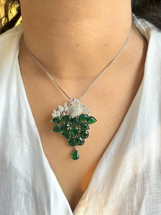 Shop Morni Pendant Set In Green Doublet & AD Stones Online in India. Pendant sets in different stones like Kundan, Moissanite, CZ stones and AD stones in all kinds quality are available online for purchase on website. Explore pendant sets for festive occasions perfect mothers and elderly ladies too. Pendant sets in green, blue, pink, red and white stones are available for wearing with sarees, lehengas, suits and Indo-westerns. -first