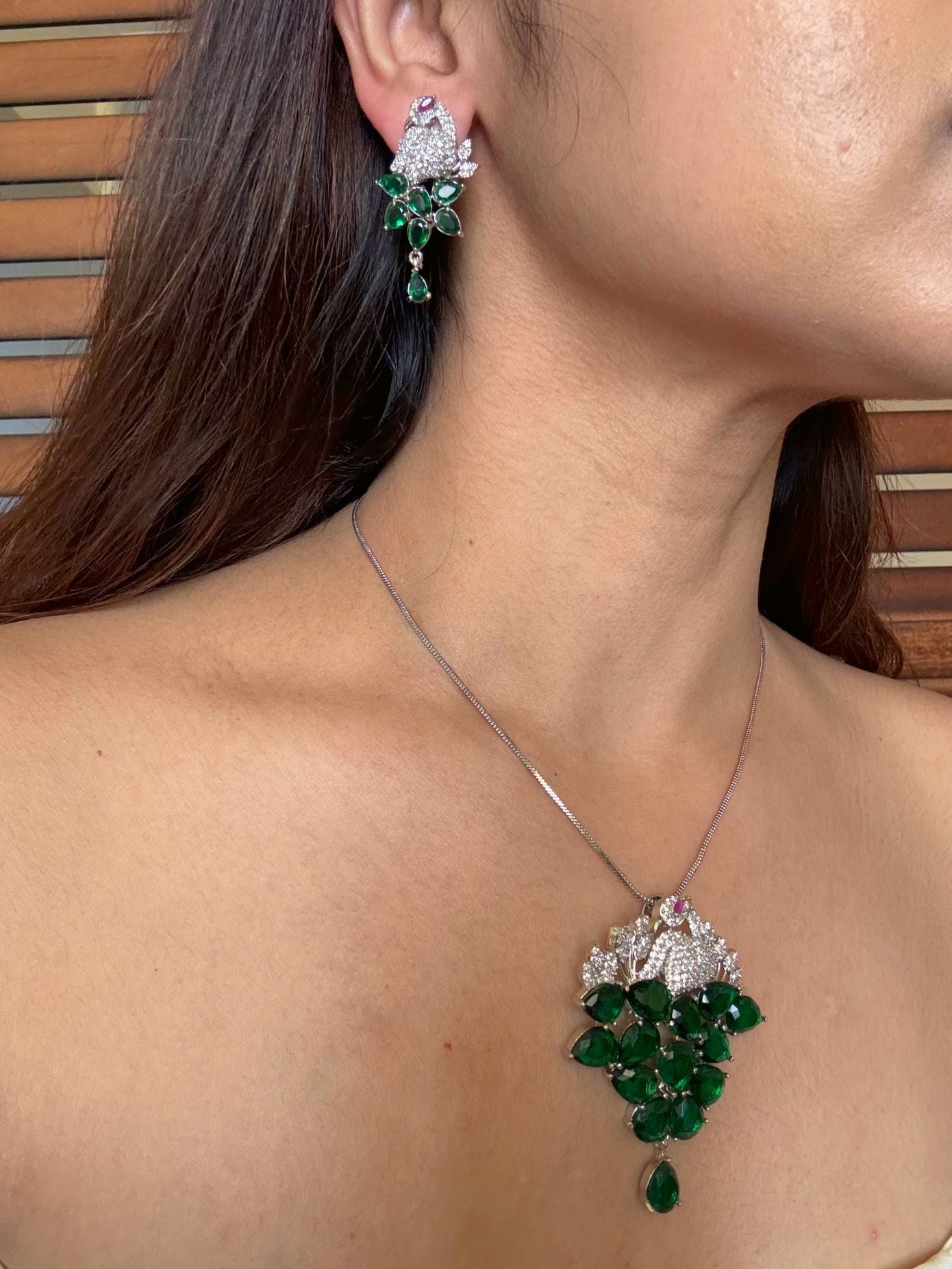 Shop Morni Pendant Set In Green Doublet & AD Stones Online in India. Pendant sets in different stones like Kundan, Moissanite, CZ stones and AD stones. -side