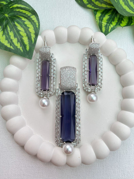 Shop Doublet Purple Stone Pendant Set In AD & Pearl Drop Online in India. Pendant sets in different stones like Kundan, Moissanite, CZ stones and AD stones in all kinds quality are available online for purchase on website. Explore pendant sets for festive occasions perfect mothers and elderly ladies too. Pendant sets in green, blue, pink, red and white stones are available for wearing with sarees, lehengas, suits and Indo-westerns. -first