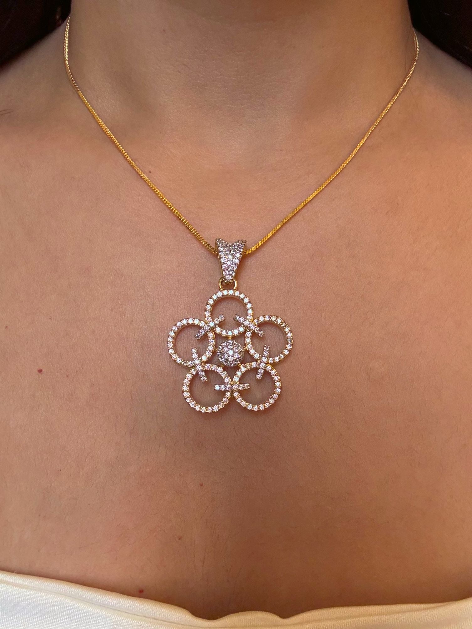 Shop Sunanda Pendant Set With Chain In Gold Polish Online in India. Pendant sets in different stones like Kundan, Moissanite, CZ stones and AD stones. -first