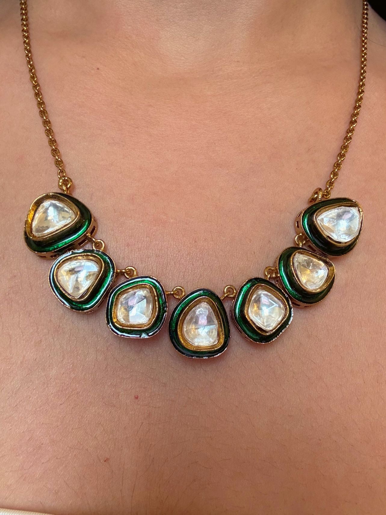 Shop Anuradha Kundan Pendant Set With Chain In Gold Polish Online in India. Pendant sets in different stones like Kundan, Moissanite, CZ stones and AD stones. -front
