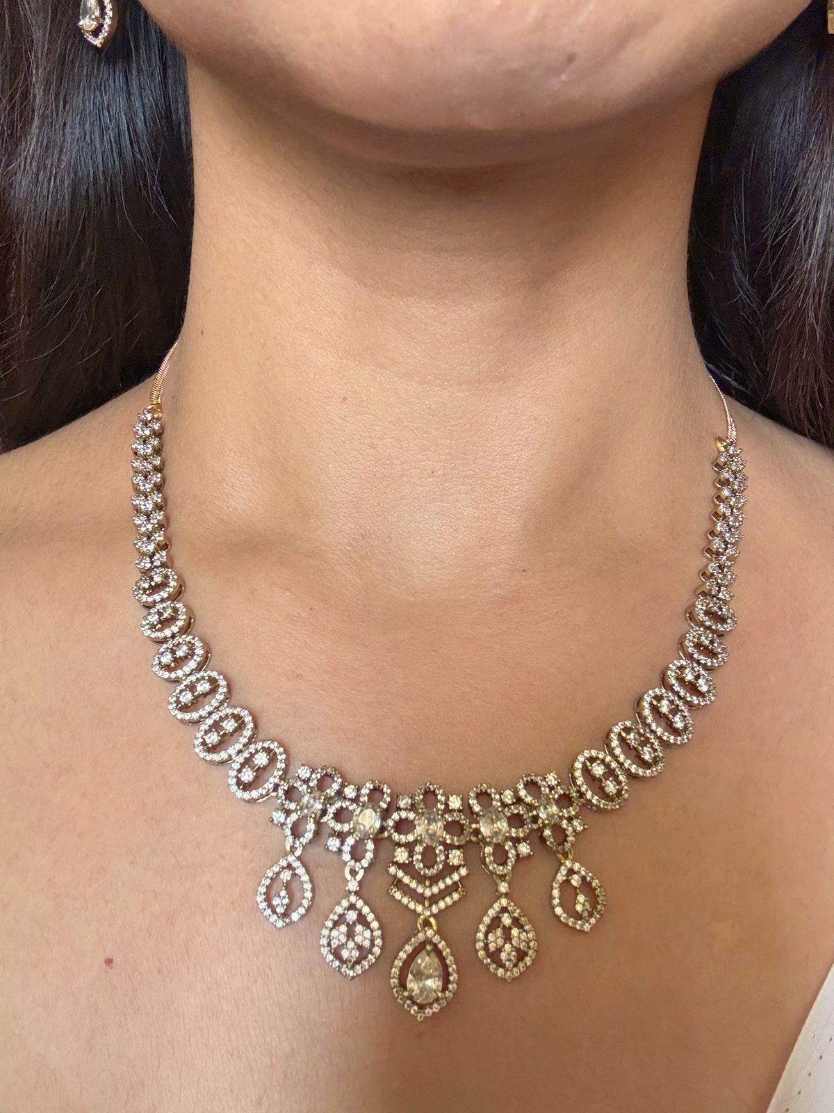 Buy white boond antique gold AD necklace set online in India. Shop from an exclusive range of jewellery, gold imitation necklace, brass necklace for weddings. -front