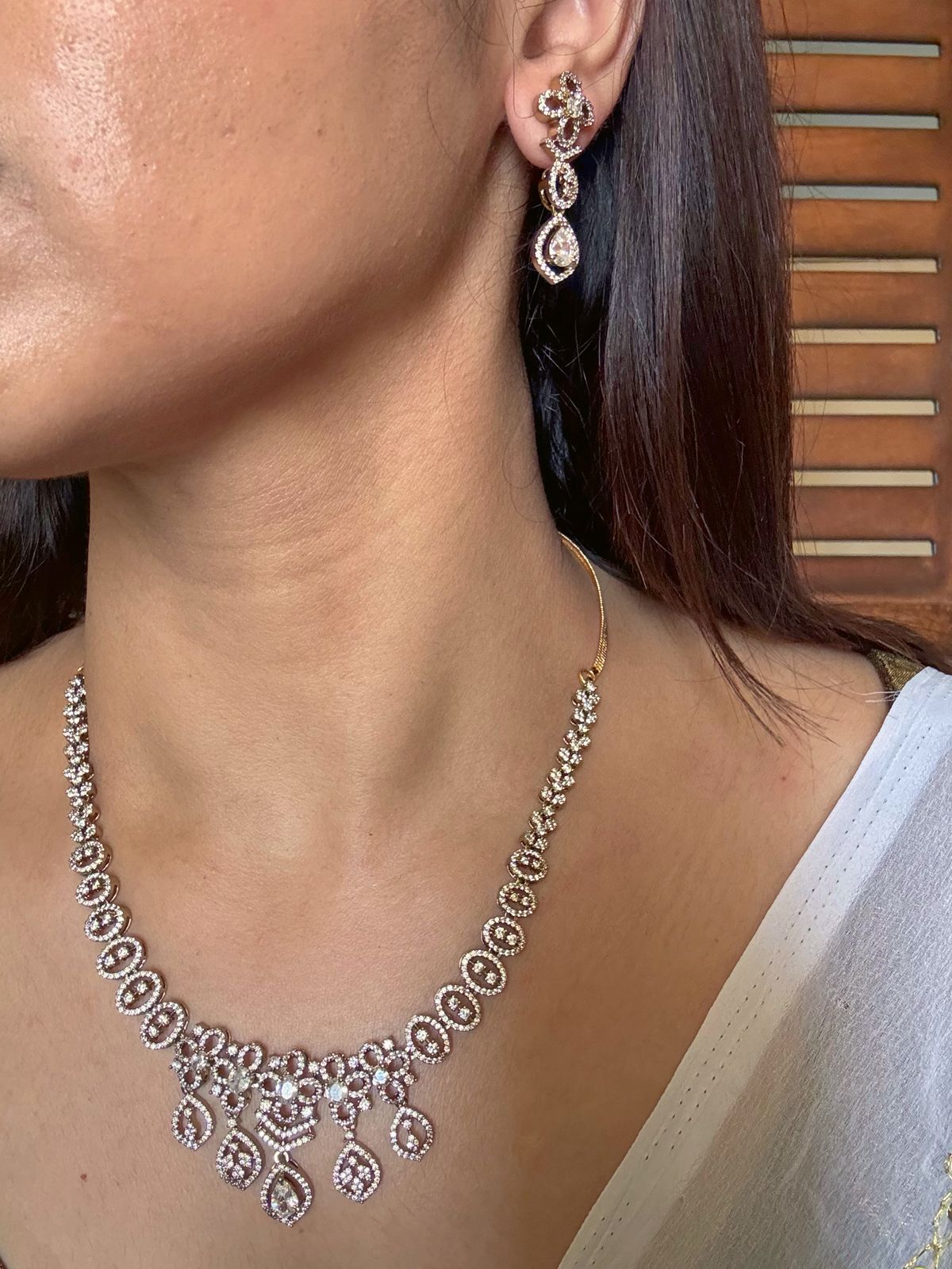 Buy white boond antique gold AD necklace set online in India. Shop from an exclusive range of jewellery, gold imitation necklace, brass necklace for weddings. -side